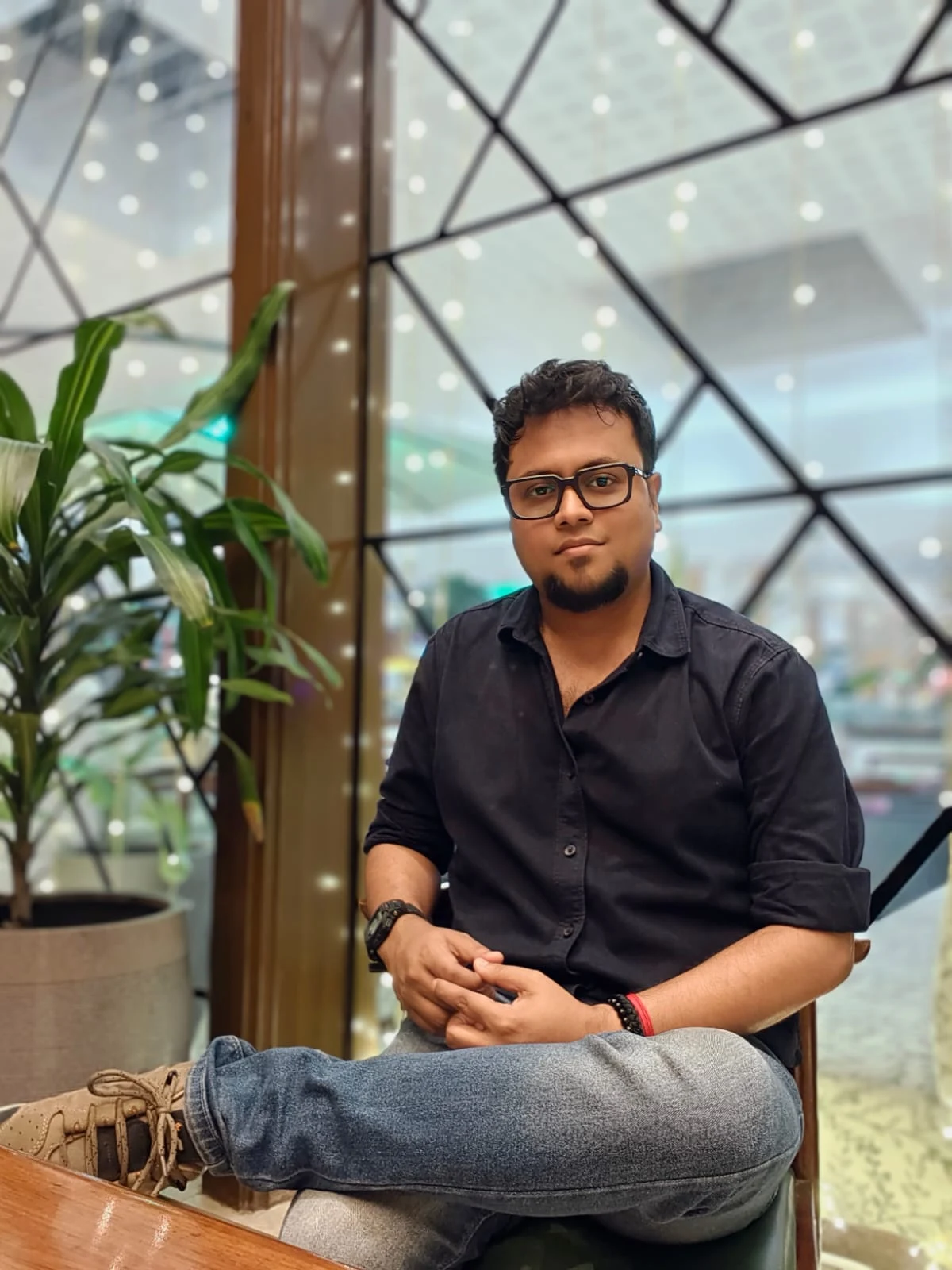 Dr. Subhabrata Dhar seated in a welcoming indoor setting